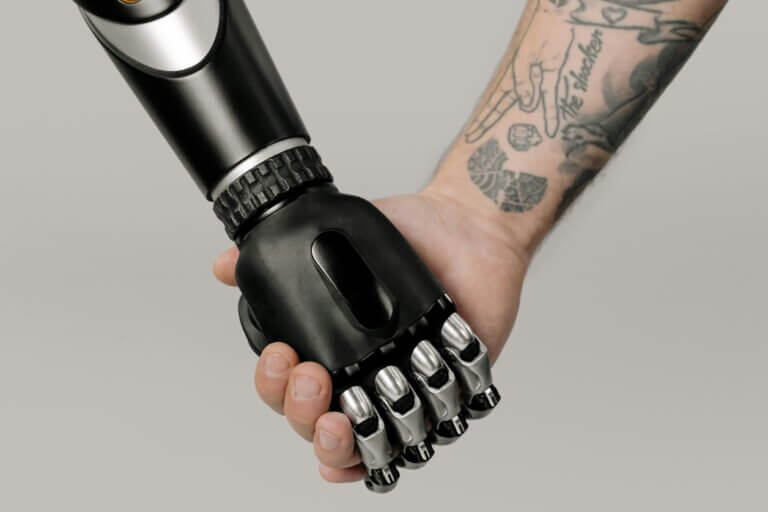 Robot hand and hand with person